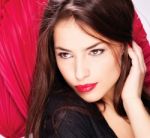 Woman In Front Of Red Fans Stock Photo