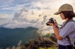 Hiker Girl Looking Photo On Camera Stock Photo