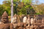 Statues Of Ancient Khmer Warrior Heads Carry Giant Snake Decorat Stock Photo