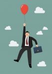 Businessman Flying With Red Balloon Stock Photo