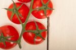 Fresh Cherry Tomatoes On A Cluster Stock Photo