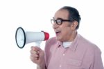 Senior Male With Megaphone Stock Photo