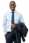 African Smiling Businessman, Hands In Pockets Stock Photo