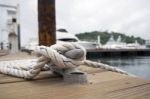 White Rope With Mooring Bollard Stock Photo