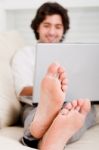 Man Sitting With Laptop Stock Photo