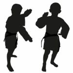 Silhouettes Of Two Little Boys Stock Photo