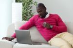 Handsome Young Man Working With His Laptop At Home Stock Photo