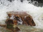 River Water Crushing Against Rock Outdoors Stock Photo