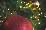 Close Up Big Red Glitter Ball Christmas On Tree With Wire White Light Background Stock Photo