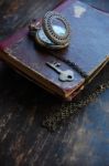 Old Pocket Watch, Book And A Key Stock Photo