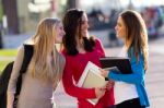 Friends Talking In The Street After Class Stock Photo