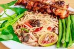 Thai Food Speak (somtam Kaiyang) : Papaya Spicy Salad With Salte Stock Photo