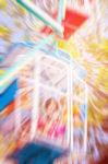 Children On A Rotating Ferris Wheel Stock Photo