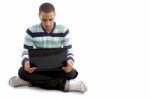 Casual Boy Sitting With Notebook Stock Photo