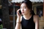 Portrait Of Thai Adult Student University Beautiful Girl Calling Smart Phone Stock Photo