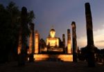 Ancient Buddha Statue At Twilight, Wat Mahathat In Sukhothai His Stock Photo