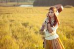 Hippie Woman Walking In Golden Field Stock Photo