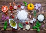 Raw Dough With Ingredients For Homemade Pizza On Shabby Wooden B Stock Photo