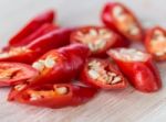 Chopped Chillies Represents Red Pepper And Burning Stock Photo