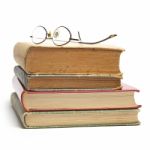 Glasses on Old Books Stock Photo