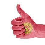 Flag Of Kyrgyzstan  On Thumb Up Hand Stock Photo