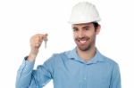 Smiling Civil Engineer Holding Key Stock Photo