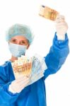 Female Doctor With Money Stock Photo