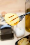 Grilled Potato On A Fork Stock Photo