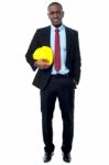 Handsome Engineer Holding Yellow Helmet Stock Photo