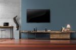 Led Tv On Concrete Wall With Wooden Furniture In Living Room Stock Photo