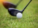 Golf Ball Behind Driver At Driving Range Stock Photo