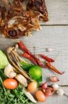 Dried Fish And Spices On Wooden Stock Photo