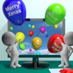 Balloons With Happy Xmas Showing Online Greeting Stock Photo