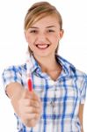 Young Women Showing Toothbrush Stock Photo