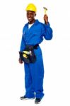 African Repairman Holding Hammer Stock Photo