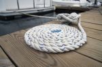 White Rope With Mooring Bollard Stock Photo