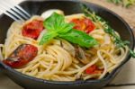 Spaghetti Pasta With Baked Cherry Tomatoes And Basil Stock Photo