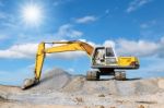 Excavator And Sky Stock Photo