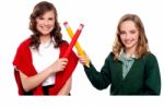 Smiling Girls Making Cross Sign Stock Photo