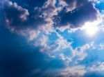 Beam Of Sunlight Behind Dark Clouds In The Countryside Stock Photo