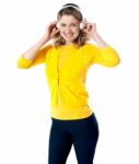 Smiling Lady Enjoying Music Stock Photo