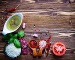 The Ingredients For Homemade Pizza On Shabby Wooden Background Stock Photo