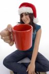 Sitting Woman Showing Coffee Mug Stock Photo