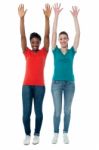 Women Raising Their Arms Up In Excitement Stock Photo