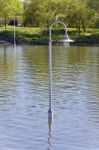 Isolated Image Of A Lights Posts In Water Stock Photo