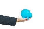 Businessman Hand Holding Piggy Bank On White Background Stock Photo