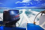 Rear View From Speed Boats Running Against Clear Sea Blue Water Stock Photo