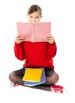 Girl Sitting With Books On Her Lap Stock Photo