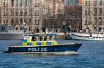 Police Launch Cruising Along The River Thames Stock Photo