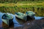 Rowing Boats Moored At Watendlath Tarn In The Lake District Cumb Stock Photo